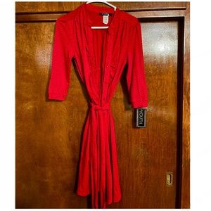 Red dress with buttons and black polka dots with a belt to highlight your waist.